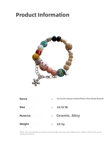 Detail shot of ceramic lucky cat bracelet with floral charms and 18.5cm measurement