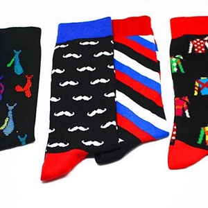 Set of four fashionable cotton crew socks with colorful tie and geometric patterns