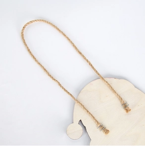 Close-up of natural wood Christmas hanging decor with rope attachment on the back