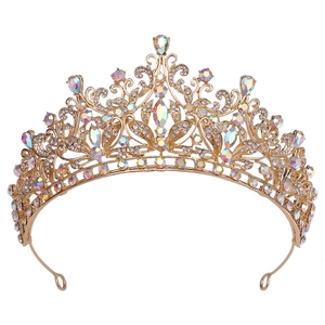 Detailed close-up of luxury gold crown featuring colorful crystals and side securing loops