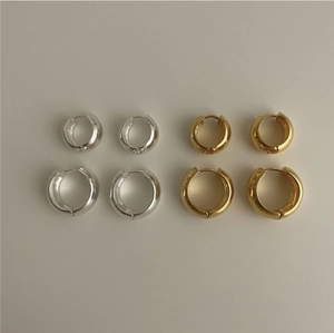 Detailed comparison of thick geometric silver and gold hoop earrings in two sizes