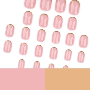 Minimalist short nude pink press-on nails with elegant gold French reverse tips