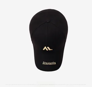 Detail of gold Ataraxia embroidery on black twill cotton baseball cap from top view