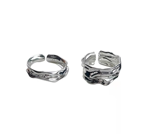 Detailed view of S925 sterling silver ring featuring irregular wave texture and hallmarks