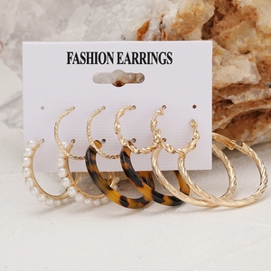 Minimalist 5-pair earring set featuring gold hoops, acrylic tortoiseshell, and white pearls