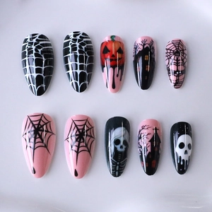 Pink and black Halloween almond press-on nails with spider web and pumpkin designs