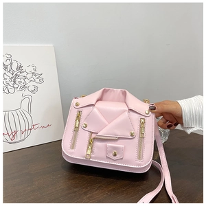Detail of pink motorcycle jacket shaped mini crossbody bag showing zipper and lapels