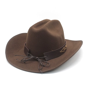 Close-up of brown felt cowboy hat featuring leather band with golden arrow stitching