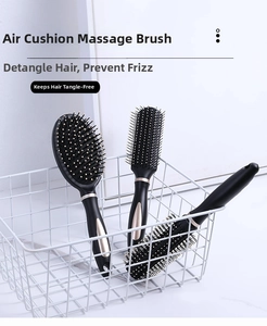 Three-piece black anti-static hairbrush set featuring paddle, flat, and round styling brushes