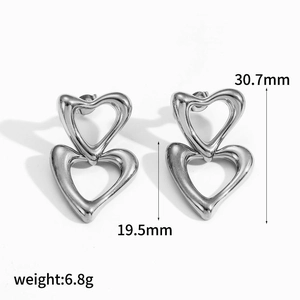 Detail view of double heart earrings with 30.7mm height and 19.5mm width dimensions
