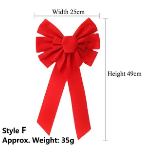 Detail view of large red velvet Christmas bow with 25cm width and 49cm height dimension
