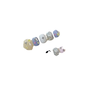 Star-themed pastel purple and white press-on nails with 3D star and pearl accents