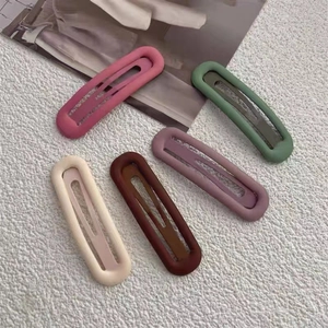 Close-up of five matte hollow BB hair clips in pastel Morandi candy colors