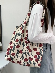 Floral canvas shoulder bag with vintage oil painting print on beige background worn by model