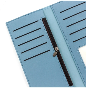 Detail view of light blue PU leather wallet interior with multiple card slots and zipper pocket