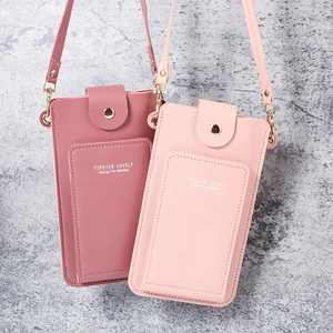 Fashionable PU leather crossbody cell phone bag in pink colors with textured finish