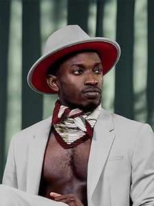 Detail view of two-tone wool fedora hat in gray and red with stylish pleated scarf