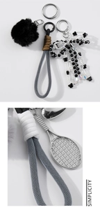 Detail of a silver tennis racket pendant and woven lanyard for this plush pompom keychain