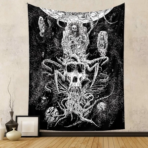 Detail of bohemian skull tapestry with cosmic planets and tentacles on a textured grey wall