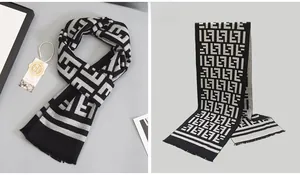 Macro detail of men's wool scarf featuring grey plaid pattern and fringe texture