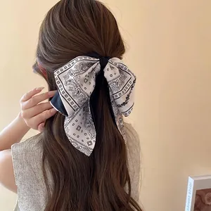 Elegant black and white paisley bow hair claw clip for French retro hair styling