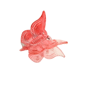Mini butterfly hair claw clip in translucent red resin with a strong metal spring
