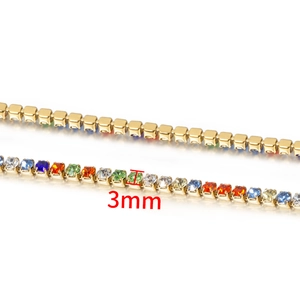 Detailed close-up of 3mm colorful cubic zirconia stones on a golden stainless steel chain