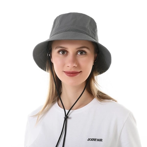 Detail of dark grey sun hat featuring an adjustable windproof drawstring and fine stitching