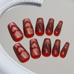 Sparkling dark red cat eye press-on nails with heart patterns and coffin shape