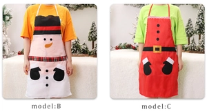 Detail of Santa and Snowman Christmas aprons with festive belts and character patterns