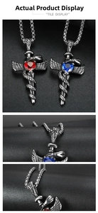 Detail of gothic sword cross pendants with red and blue heart gems and wing texture
