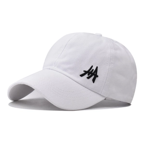 Detail of white cotton ponytail baseball cap featuring black side embroidery logo