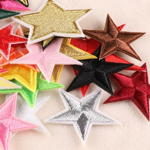 Colorful star-shaped embroidered patches in gold, silver and red for DIY clothing decor