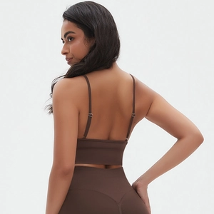 Detail of deep brown ribbed fabric on seamless yoga bra with fine shoulder straps
