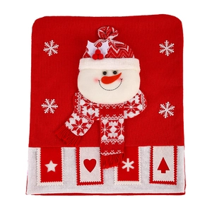 Red knitted Christmas chair cover featuring 3D snowman and festive embroidery patterns