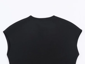Detail shot of the V-neckline and shoulder stitching on a black sleeveless midi dress
