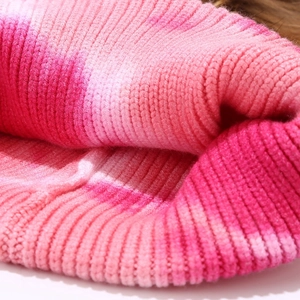Pink gradient tie-dye ribbed knit beanie featuring a soft fur pompom and thick texture