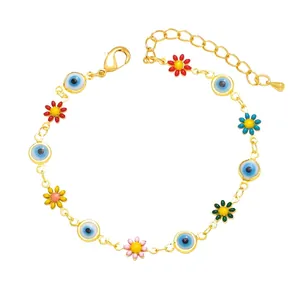 Gold evil eye charm bracelet with colorful enamel flower pendants and adjustable clasp