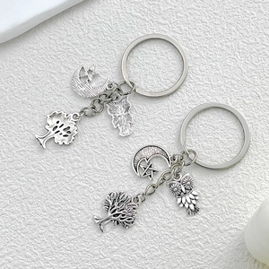 Antique silver keychain set featuring tree of life, moon, star, and owl charms