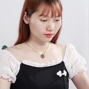 Chic interlocking double ring pendant necklace with blue enamel and sparkling crystals