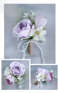 Detail of lilac rose boutonniere with twine wrap and pearl beads for wedding attire