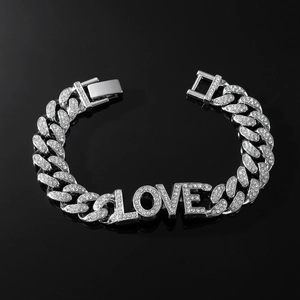 Silver iced-out Cuban link bracelet featuring rhinestone LOVE letters and a watch clasp