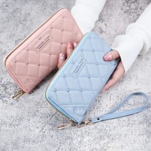 Women's long zipper wallets in pink and blue with heart quilted patterns and embroidery