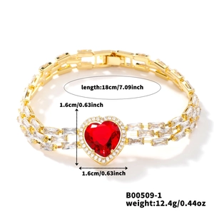 Detail showing 18cm gold heart bracelet with red zircon and rectangular stone chain