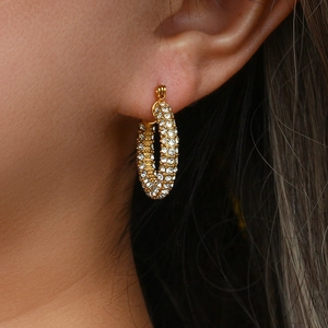 Elegant 18K gold plated U-shaped hoop earrings with cubic zirconia on female model