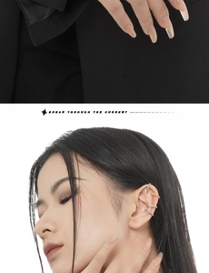 Detail of four-piece set of gold and silver spiral textured ear cuffs for non-pierced ears