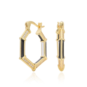 Detailed view of gold hexagon earrings with 925 silver hallmark and enamel inlay