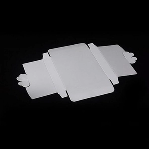 Foldable white paper gift box with decorative heart-shaped closure on a black background