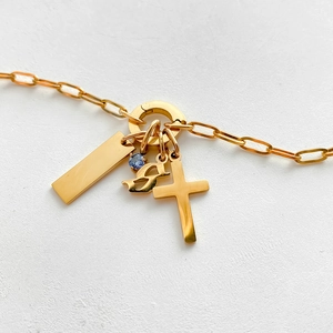 Gold titanium steel necklace featuring cross, gothic S, and blue crystal pendants