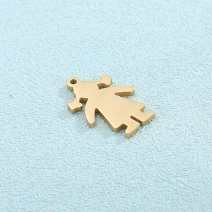 Close-up of a gold stainless steel stylized girl pendant on a light blue background